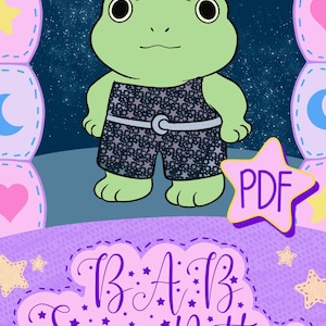 May include: A digital illustration of a light green frog wearing dark blue shorts with a white star pattern and a light blue belt. The image features a yellow star-shaped badge labeled PDF and text reading B.A.B. Sewing Pattern in purple.