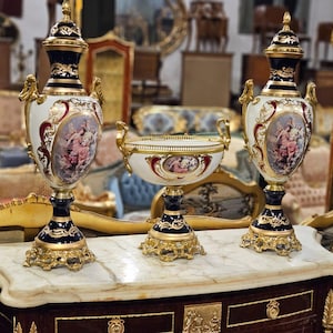 Pair of Large Hand-Painted Porcelain Urns with Gilt Bronze Bases – French Rococo Style