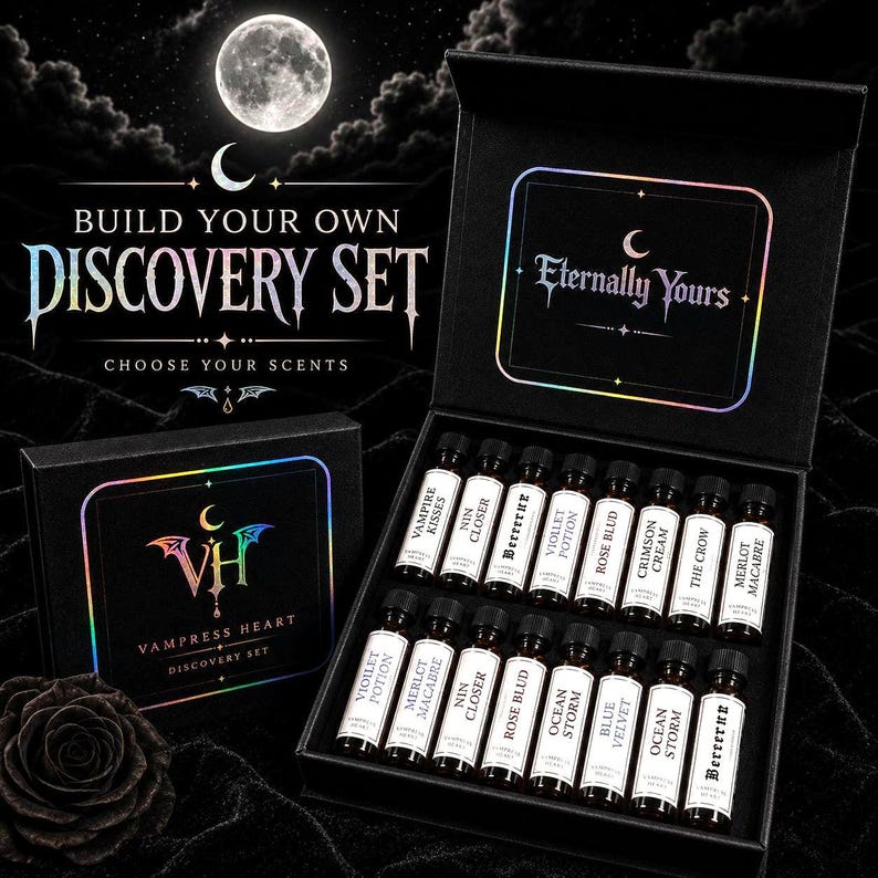 May include: A black discovery set box containing sixteen small glass vials with white labels, each printed with scent names like Vampire Kisses, Rose Blud, and Merlot Macabre. The box lid features the text Eternally Yours and Vampress Heart.