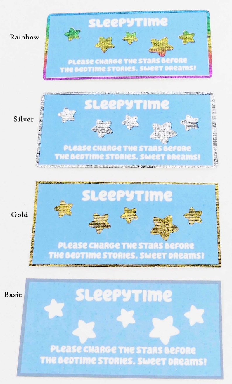 May include: Four blue cards with the text "SLEEPYTIME" and the words "PLEASE CHARGE THE STARS BEFORE THE BEDTIME STORIES. SWEET DREAMS!" The cards have different colored borders: rainbow, silver, gold, and basic.