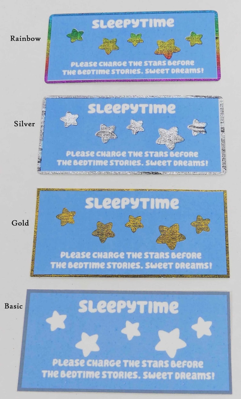 May include: Four blue cards with the text "Sleepytime" and "Please charge the stars before the bedtime stories. Sweet dreams!"  The cards have different colored stars: rainbow, silver, gold, and white.