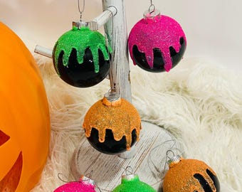 Halloween ornaments. Ornament set of six. Black with bright color drips.