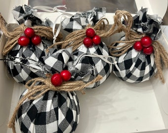 Four piece set of black and white ornaments