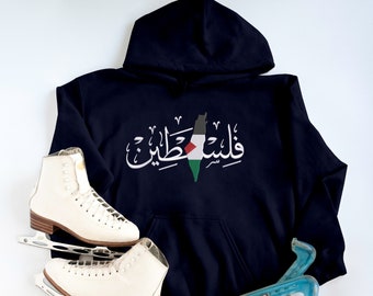 May include: A navy blue hoodie with a white graphic of the Palestinian flag and the Arabic text "فلسطين" (Palestine).