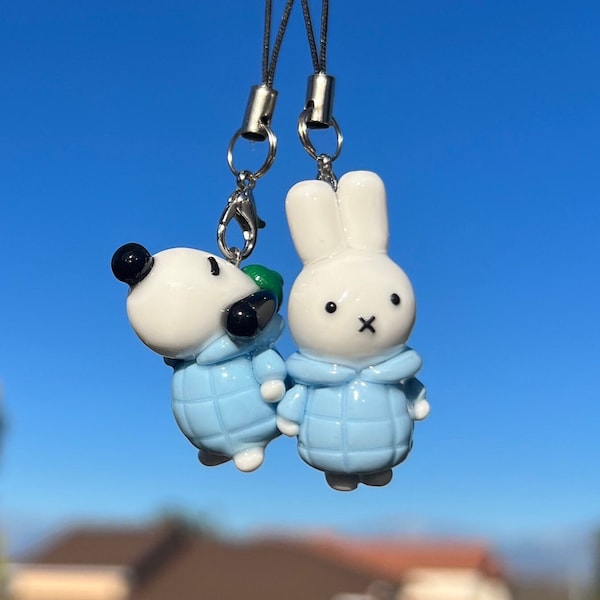 Miffy and Snoopy in a puffer coat keychain duo