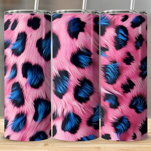 May include: Three stainless steel tumblers featuring a pink and blue leopard print design. The tumblers are insulated and have a lid.