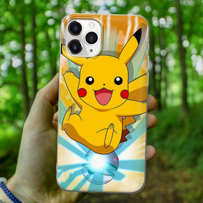 May include: A clear phone case with a yellow Pikachu character from the Pokemon franchise. The character is in a dynamic pose with a blue and white background.