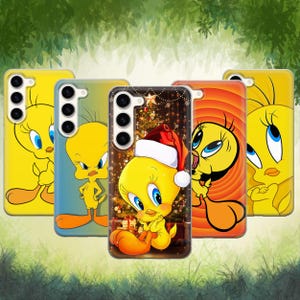 May include: Five phone cases showcasing Tweety Bird designs. The cases are in shades of yellow, orange, and blue. One case features Tweety wearing a Santa hat, set against a Christmas tree backdrop. The cases are for mobile phones.