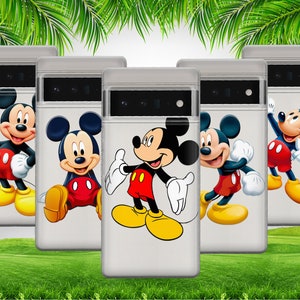 May include: Four clear phone cases with different Mickey Mouse designs. The cases are white with a black outline and a Mickey Mouse character in the center. The Mickey Mouse characters are all smiling and have different poses. The cases are all on a green grassy surface.
