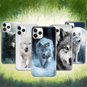 May include: A collection of phone cases featuring wolf designs. The cases display various wolf illustrations, including close-up portraits and full-body images, in both color and black and white. The cases are shown against a blurred green and white background.