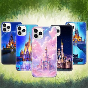 May include: Five phone cases with colorful castle designs. The cases feature various backgrounds, including a night sky, a sunset, and a pink cloudy sky. Each case has a different castle illustration.