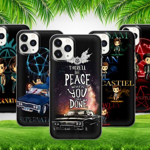May include: Set of five black phone cases with different designs featuring characters from the TV show Supernatural. The designs include a black and white symbol, a car, a galaxy background with text, a group of characters, and a red symbol.