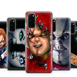 May include: A collection of five phone cases featuring horror-themed designs. The cases showcase images of a doll with red hair and overalls, a stitched face, and a scary face with long black hair. The cases are in a row.