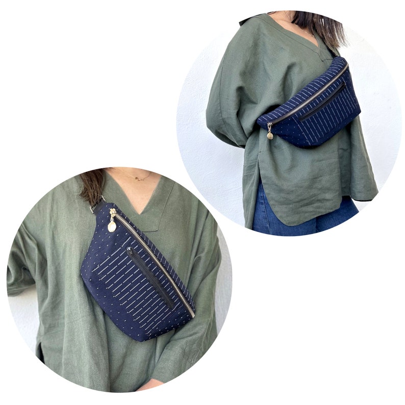 K&ouml;nnte beinhalten: Eine dunkelblaue Bauchtasche mit einem wei&szlig;en und schwarzen Muster. Die Bauchtasche hat einen Rei&szlig;verschluss und einen goldenen Rei&szlig;verschluss-Zipper. Die Bauchtasche wird von einer Person getragen, die ein gr&uuml;nes Hemd tr&auml;gt.