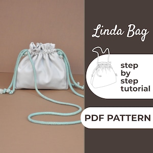 May include: A white drawstring bag with light blue rope straps and tassels. The bag is made of a soft, gathered material. The text "Linda Bag" and "step by step tutorial" are visible in the image. The words "PDF PATTERN" are also visible.