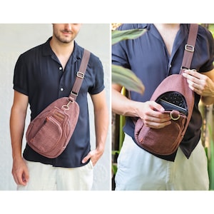 May include: A brown crossbody bag with a zipped pocket and a flap closure. The bag has a brown leather strap and a label that says "HANDMADE".