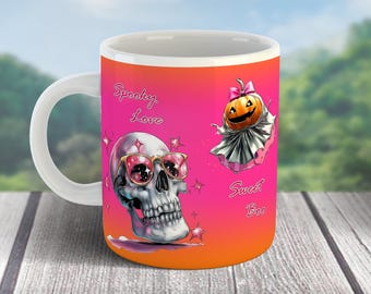 May include: White ceramic mug with a Halloween theme. The mug features a skull wearing pink sunglasses and a pumpkin ghost with the phrases "Spooky Love" and "Sweet Boo" in pink script against a pink and orange gradient.