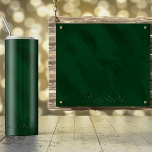 May include: A green stainless steel tumbler with a straw and the text "Made By Owl" on the side. The tumbler is sitting on a wooden surface in front of a green sign with the same text hanging from a chain.