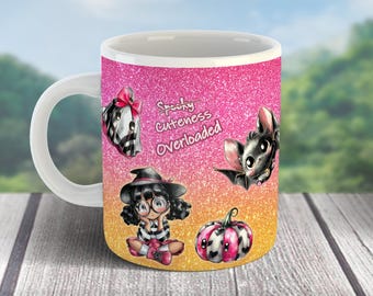 May include: White ceramic mug with a pink and orange glitter background. The mug features cartoon illustrations of a bat, a pumpkin, a girl, and a horse. Text on the mug reads "Spooky Cuteness Overloaded".