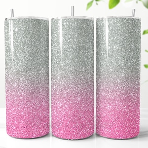 May include: Three stainless steel tumblers with a silver glitter ombre design that fades to pink.