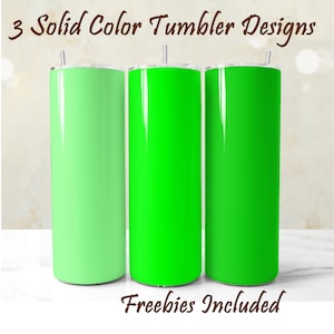 May include: Three stainless steel tumblers with different shades of green. The tumblers are all the same size and shape. The text "3 Solid Color Tumbler Designs" is at the top of the image. The text "Freebies Included" is at the bottom of the image.