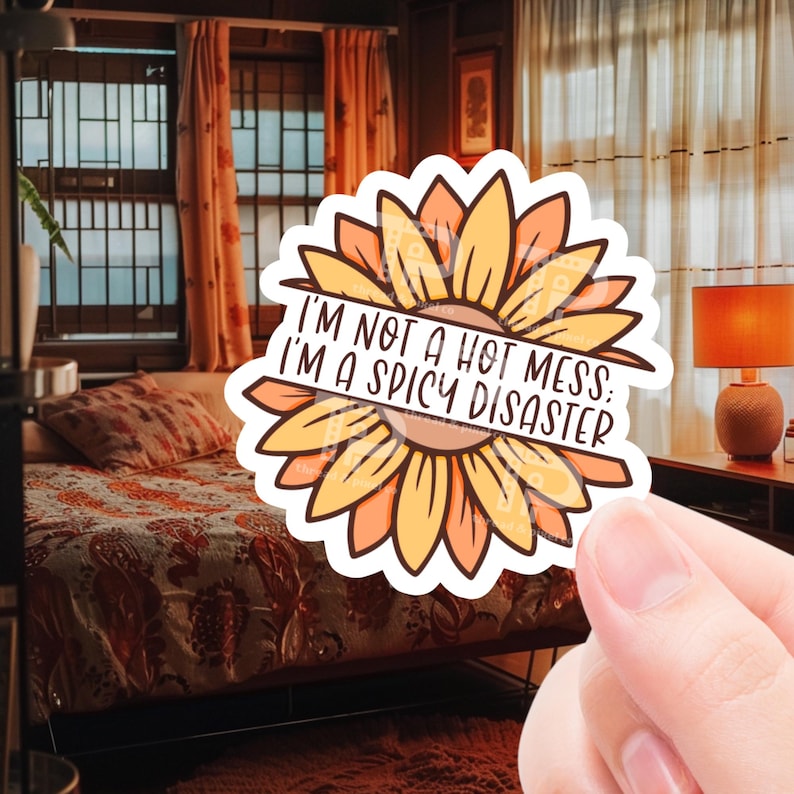 May include: A sticker with a sunflower design and the text "I'm not a hot mess. I'm a spicy disaster."