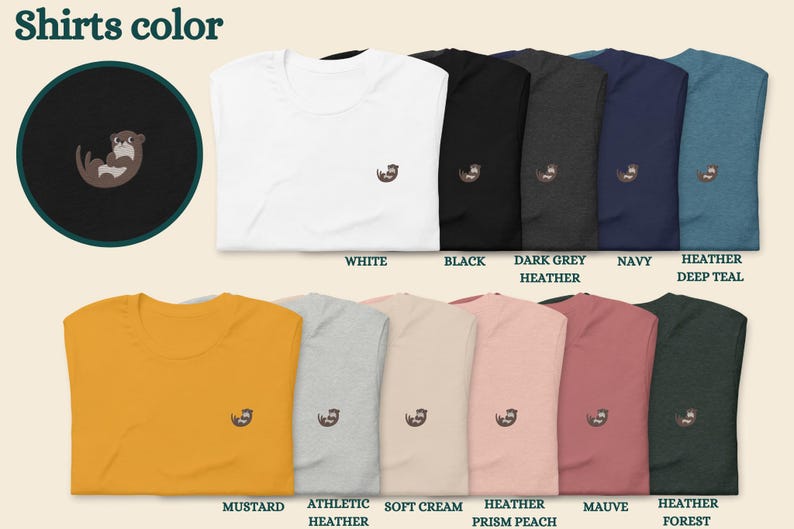 May include: A variety of t-shirts in different colors, featuring a small embroidered otter design. The colors include white, black, dark grey heather, navy, heather deep teal, mustard, athletic heather, soft cream, heather prism peach, mauve, and heather forest.