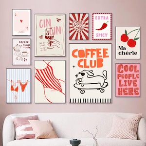 May include: A collection of framed art prints with various designs. The prints feature illustrations of a coffee maker, cherries, a dog on a skateboard, a swimsuit, and text that reads "Coffee Club", "Extra Spicy", and "Cool People Live Here".
