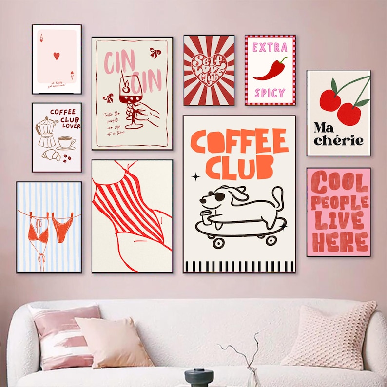 May include: A collection of framed art prints with various designs. The prints feature illustrations of a coffee maker, cherries, a dog on a skateboard, a swimsuit, and text that reads "Coffee Club", "Extra Spicy", and "Cool People Live Here".