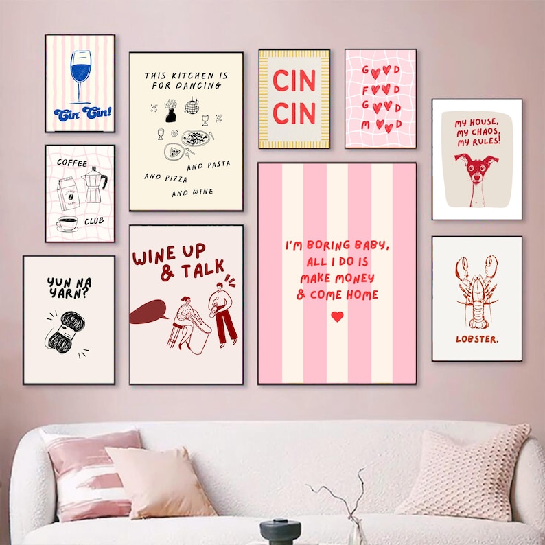 May include: A collection of framed art prints with various designs and text. The prints feature illustrations of a wine glass, coffee, a dog, a lobster, and text like "Gin Gin!", "This kitchen is for dancing", and "I'm boring baby".
