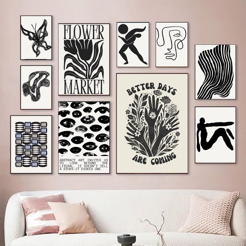May include: A collection of framed art prints in black and white, featuring abstract designs, botanical illustrations, and text. The prints include a butterfly, a flower, a figure, and the words "Better Days Are Coming."