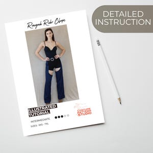 May include: A white paper with the text "Renegade Rider Chaps" and "Illustrated Tutorial" is displayed. The paper shows a woman wearing a black bodysuit and blue chaps. The text "Detailed Instruction" is also visible. A pencil is on the right.