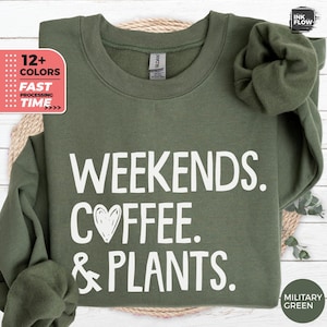 May include: A green sweatshirt with the text "WEEKENDS. COFFEE. & PLANTS." in white lettering.