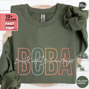 May include: A green sweatshirt with the text "Board Certified Behaviour Analyst" and the acronym "BCBA" in colourful letters. The sweatshirt is available in 12+ colours.