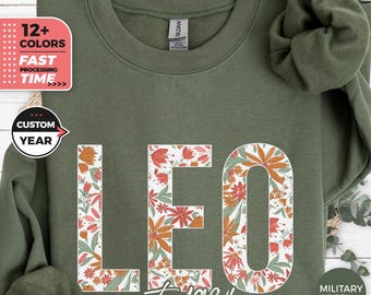 Sudadera con estampado floral personalizado de Leo, regalo personalizado, sudadera con capucha del zodiaco, suéter con estampado de flores silvestres del signo Leo, regalo astrológico para ella, top con estampado floral personalizado para el año.