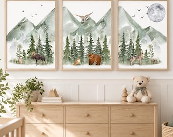 May include: A set of three watercolor wall art prints featuring forest landscapes with green mountains, pine trees, and wildlife including a moose, owl, fox, bear, and wolf, with a full moon and birds in the sky against a white background.