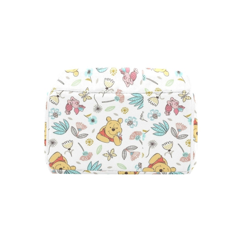 May include: A white canvas tote bag with a repeating pattern of Winnie the Pooh and Piglet characters, flowers, and leaves. The characters are in shades of yellow, pink, and red, and the flowers are in shades of pink, blue, and yellow.