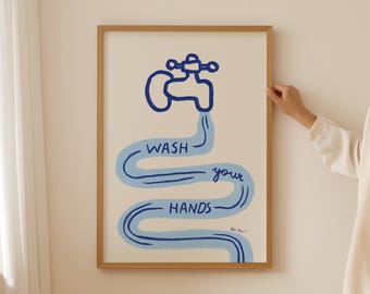 May include: A framed print with a blue illustration of a faucet with water flowing out of it. The water forms a wavy line that reads "WASH your HANDS".