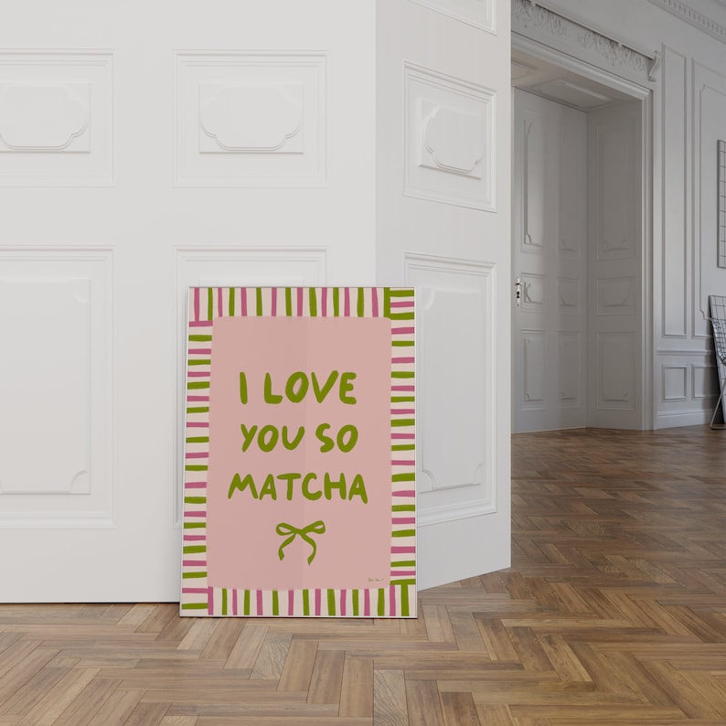 May include: A pink and green striped poster with the text "I love you so matcha" and a green bow.
