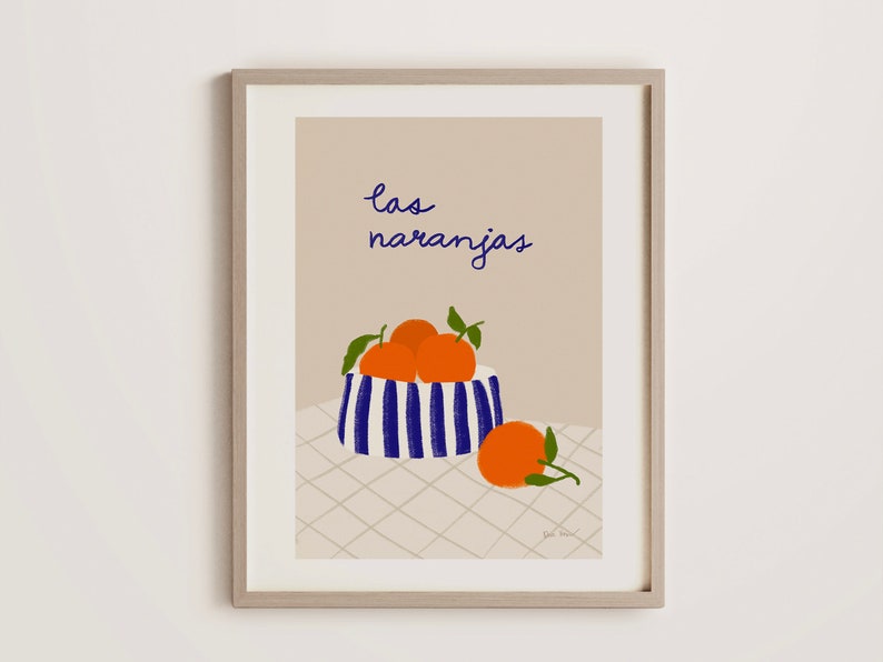 May include: A print of a still life featuring a bowl of oranges with the text "las naranjas" in blue cursive.