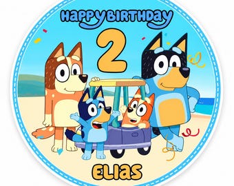 May include: A circular cake topper featuring the cartoon characters Bluey, Bingo, and their parents on a beach. The text reads Happy Birthday at the top and Elias at the bottom, with a large number 2 in the center. The design includes confetti.