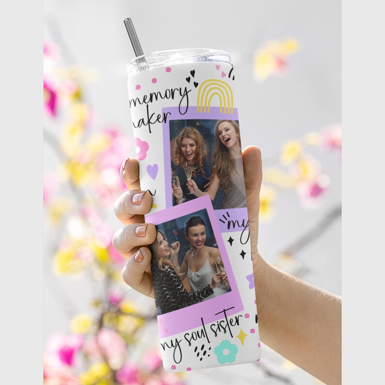 May include: White stainless steel tumbler with a straw, featuring the words "memory maker" and "my soul sister" in script. The tumbler has two photos of women and decorative elements like hearts and a rainbow.