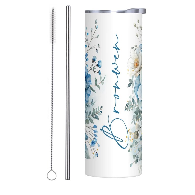 May include: A white tumbler with a blue floral design and the name "Breanna" written in blue script. The tumbler comes with a stainless steel straw and a cleaning brush.