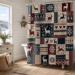 May include: A shower curtain featuring a patchwork design with a festive winter theme. The pattern includes alternating blocks of navy blue, deep red, and cream, decorated with white and dark silhouettes of reindeer, snowflakes, hearts, and trees.