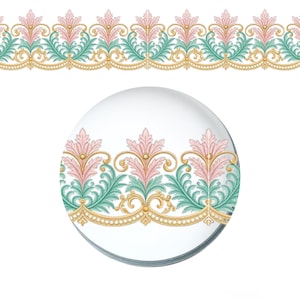May include: A decorative border pattern featuring repeating pink acanthus leaves and teal foliage accents, set against a gold-toned scrollwork base with small circular beads. The design is displayed as a continuous horizontal strip and a circular sample.