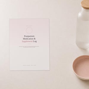 May include: A rectangular paper document with a light pink gradient background featuring the text Postpartum Medication & Supplement Log in dark grey and pink font, accompanied by a clear glass bottle with a wooden lid and a small pink bowl.