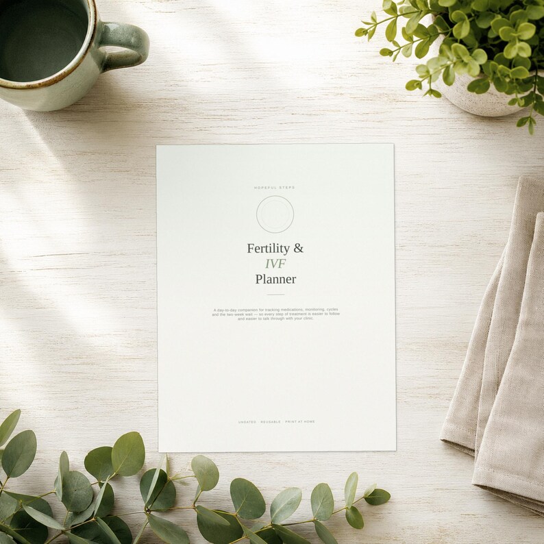 May include: A white paper planner titled Fertility & IVF Planner with a circular icon at the top. The text includes a subtitle about tracking medication, monitoring cycles, and the two-week wait, with footer text indicating it is digital and printable.