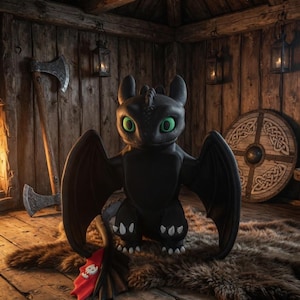 May include: A black dragon figure with large wings and bright green eyes sits on a brown fur rug. The dragon has white paw pads and a red tail fin. The background includes wooden walls, axes, a shield, and lanterns.