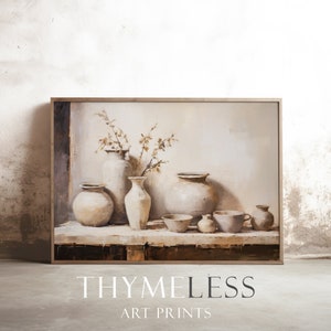 May include: A framed art print featuring a still life of neutral-toned pottery. The artwork showcases various vases, bowls, and cups, with a sprig of dried flowers in a tall vase. The text "THYMELESS ART PRINTS" is at the bottom.