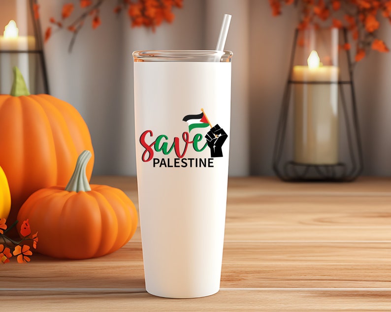 May include: White stainless steel tumbler with a black fist holding a Palestinian flag and the text "Save Palestine".
